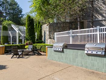 Grill station and fire pit at the residences at stevens pond in saugus, ma 01906